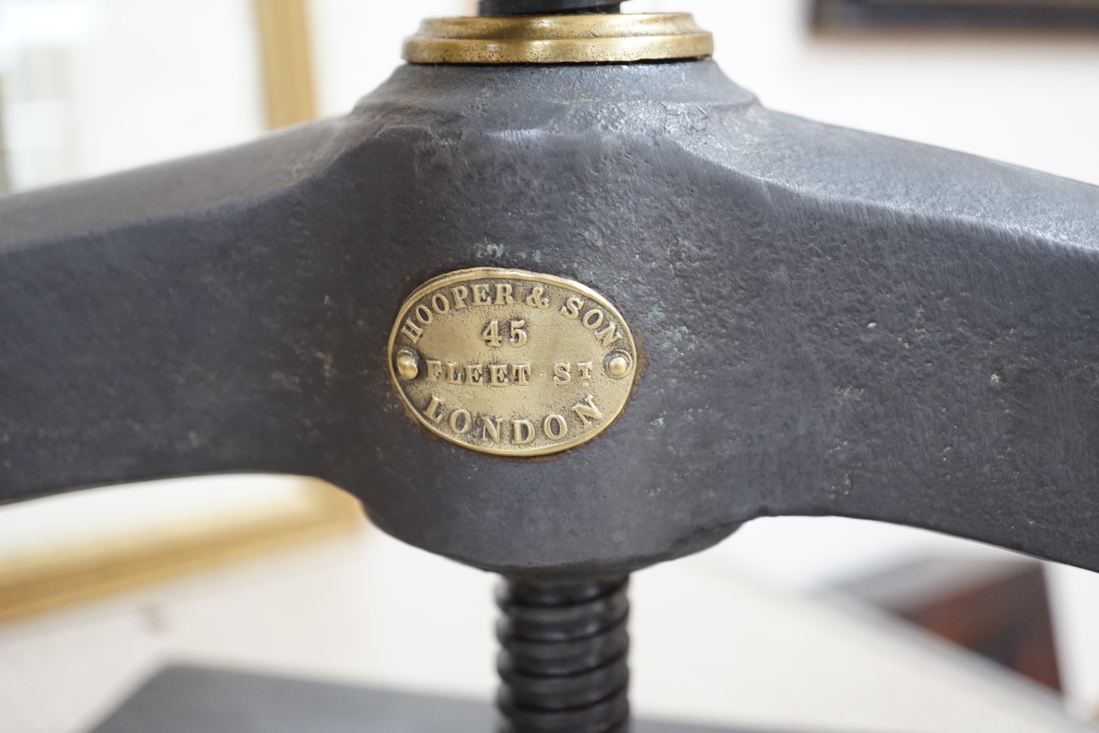 A Victorian Hooper & Son brass mounted cast iron book press, 43cm wide